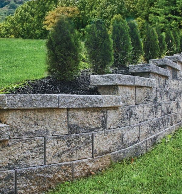 A finished retaining wall and landscape installation